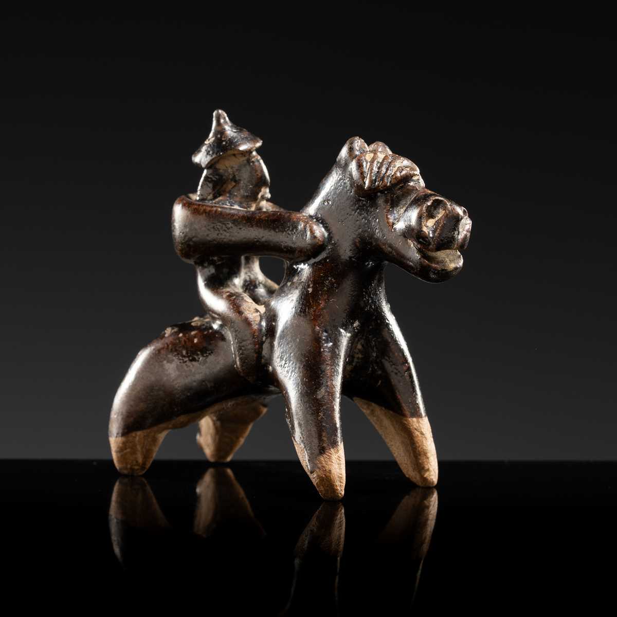 Lot 60 - A DARK BROWN GLAZED POTTERY EQUESTRIAN FIGURE, LIAO OR NORTHERN SONG DYNASTY