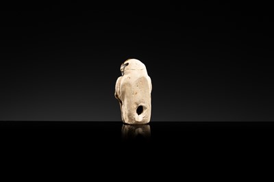 A BROWN GLAZED STONEWARE WHISTLE IN THE FORM OF A MONKEY HOLDING A PEACH, SONG TO JIN DYNASTY