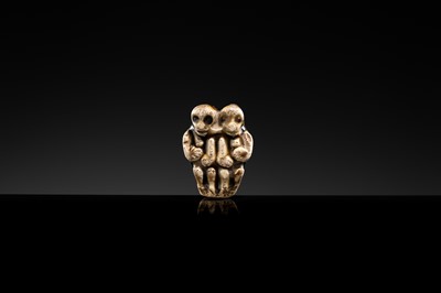 A BROWN GLAZED STONEWARE WHISTLE IN THE FORM OF A PAIR OF MONKEYS, SONG TO JIN DYNASTY