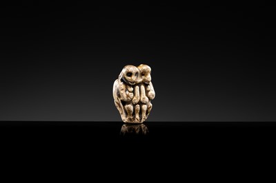 A BROWN GLAZED STONEWARE WHISTLE IN THE FORM OF A PAIR OF MONKEYS, SONG TO JIN DYNASTY