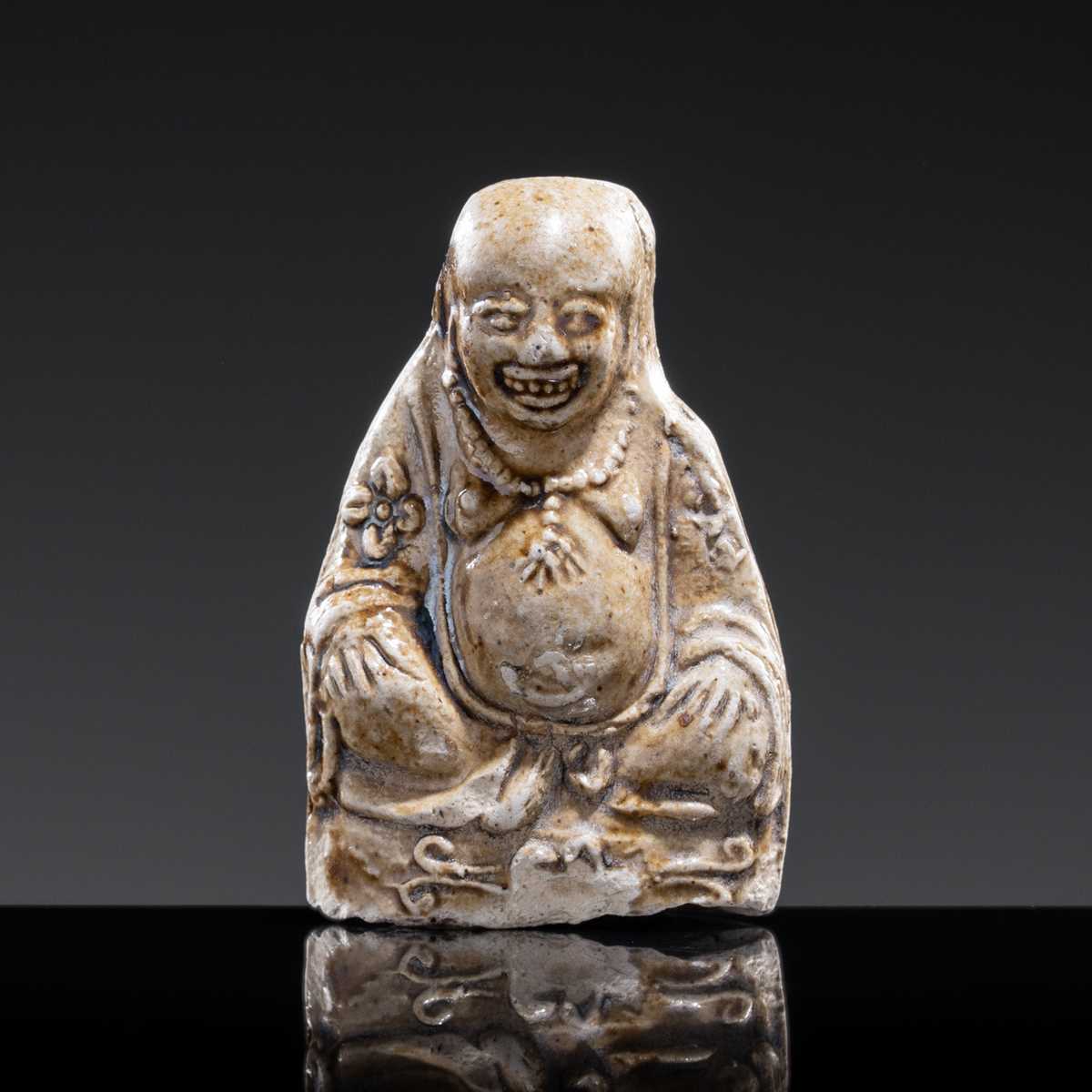 A BROWN-GLAZED POTTERY WHISTLE IN THE FORM OF A PROTECTIVE GOD, JIN DYNASTY