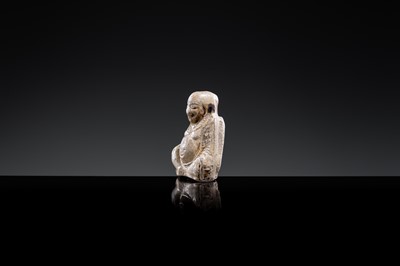 A ‘PROTECTIVE GOD’ BROWN-GLAZED POTTERY WHISTLE, JIN DYNASTY