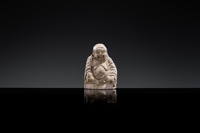 A BROWN GLAZED POTTERY WHISTLE OF A PROTECTIVE DEITY, JIN DYNASTY