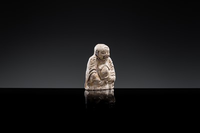 A BROWN GLAZED POTTERY WHISTLE OF A PROTECTIVE DEITY, JIN DYNASTY