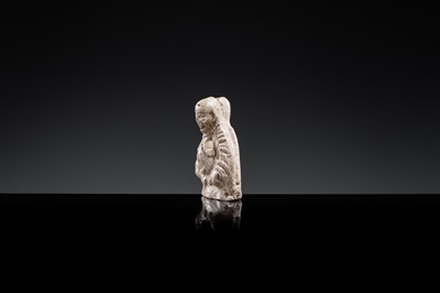 A BROWN GLAZED POTTERY WHISTLE OF A PROTECTIVE DEITY, JIN DYNASTY