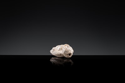 A BROWN GLAZED POTTERY WHISTLE OF A PROTECTIVE DEITY, JIN DYNASTY