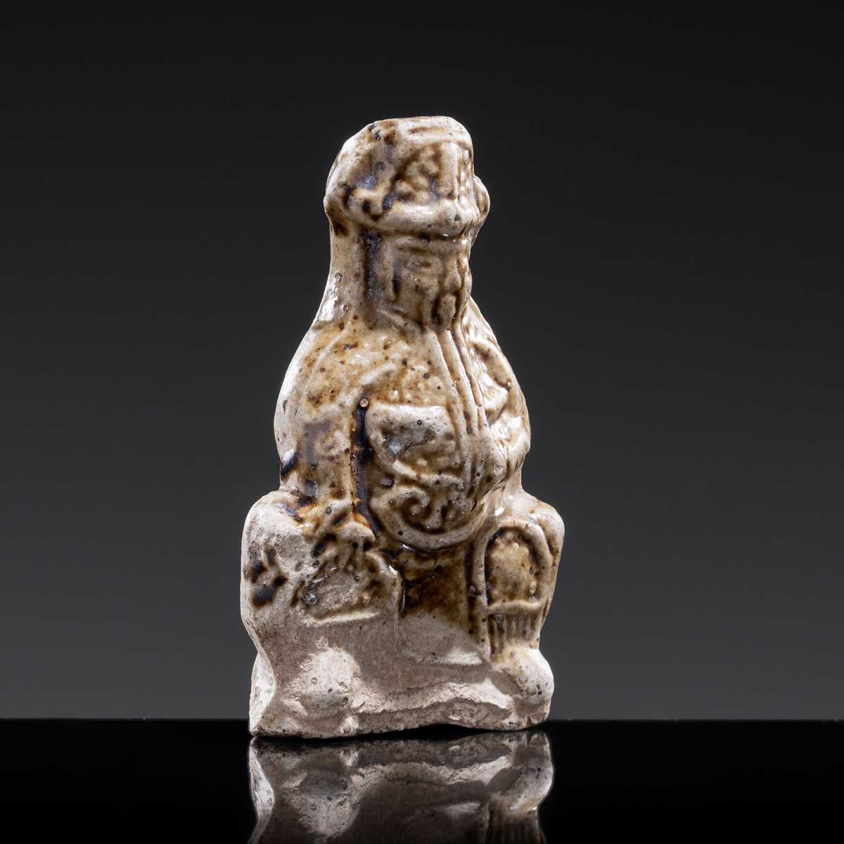 A 'DAOIST OFFICIAL' BROWN-GLAZED POTTERY WHISTLE, JIN DYNASTY