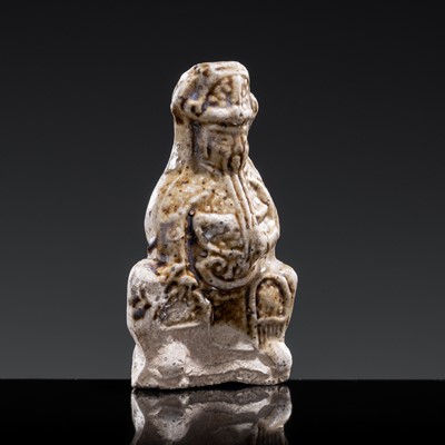 A 'DAOIST OFFICIAL' BROWN-GLAZED POTTERY WHISTLE, JIN DYNASTY