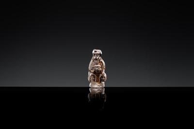 A 'DAOIST OFFICIAL' BROWN-GLAZED POTTERY WHISTLE, JIN DYNASTY