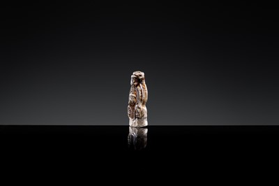 A 'DAOIST OFFICIAL' BROWN-GLAZED POTTERY WHISTLE, JIN DYNASTY