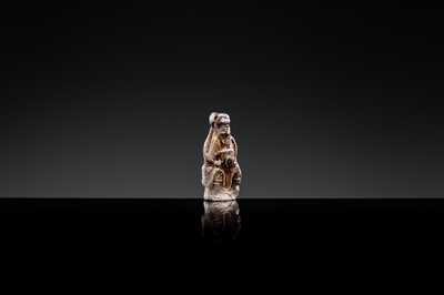 A 'DAOIST OFFICIAL' BROWN-GLAZED POTTERY WHISTLE, JIN DYNASTY