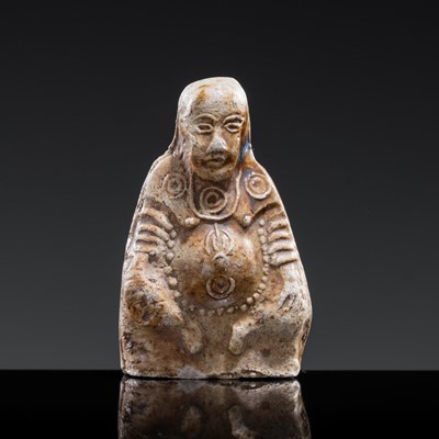 A BROWN-GLAZED POTTERY WHISTLE IN THE FORM OF A DEITY, JIN DYNASTY