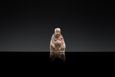 A BROWN-GLAZED POTTERY WHISTLE IN THE FORM OF A DEITY, JIN DYNASTY