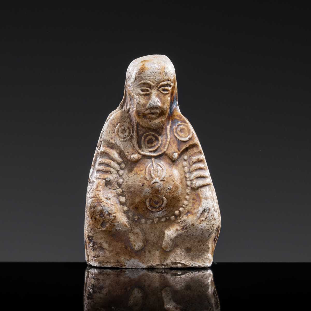 A BROWN-GLAZED POTTERY WHISTLE IN THE FORM OF A DEITY, JIN DYNASTY