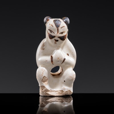 Lot 122 - A SMALL CIZHOU WARE TOGGLE IN THE FORM OF A CHILD ACTOR WITH A PAINTED FACE, JIN TO YUAN DYNASTY