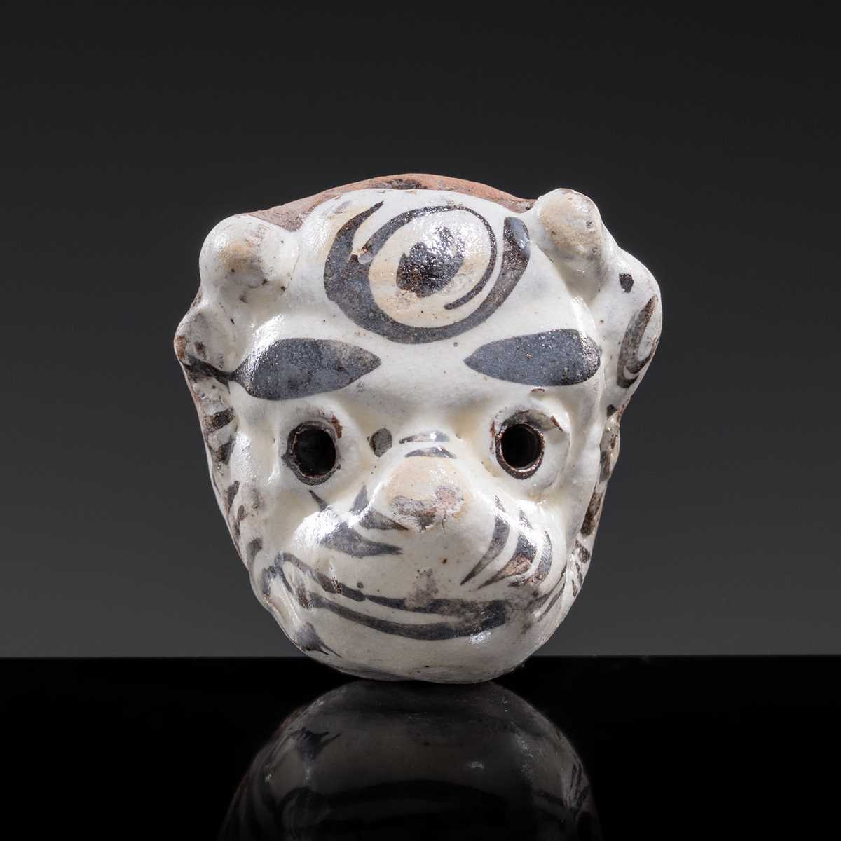 A CIZHOU SLIP PAINTED ‘TIGER MASK’ WHISTLE, JIN-YUAN DYNASTY