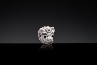 A CIZHOU SLIP PAINTED ‘TIGER MASK’ WHISTLE, JIN-YUAN DYNASTY