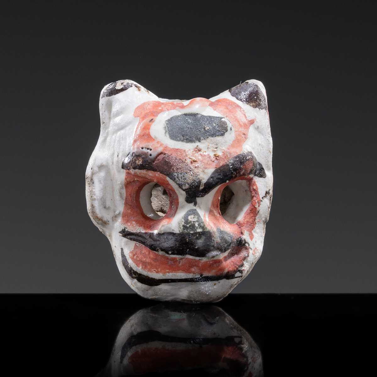 A CIZHOU SLIP PAINTED ‘THEATRE MASK’ WHISTLE, JIN-YUAN DYNASTY