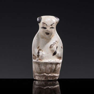 Lot 90 - A CIZHOU WARE POTTERY ‘BOY ON A LOTUS POD’ WHISTLE, SONG DYNASTY