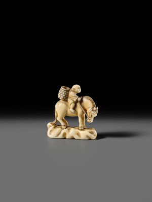 Lot 86 - AN IVORY NETSUKE OF A BOY ON A HORSE