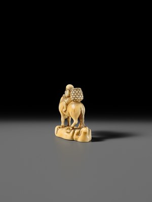 Lot 86 - AN IVORY NETSUKE OF A BOY ON A HORSE