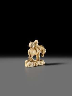 Lot 86 - AN IVORY NETSUKE OF A BOY ON A HORSE