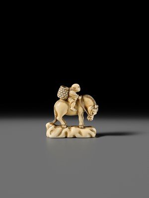 Lot 86 - AN IVORY NETSUKE OF A BOY ON A HORSE
