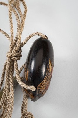 Lot 1431 - A SMALL TWO-CASE LACQUER INRO DEPICTING A SHISHI