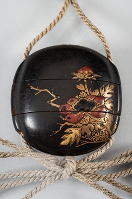 Lot 1431 - A SMALL TWO-CASE LACQUER INRO DEPICTING A SHISHI