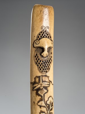 Lot 1459 - A FINE ANTLER KISERUZUTSU (PIPE CASE) WITH A DRAGONFLY AND FLOWERS