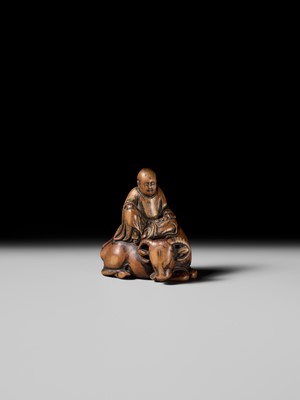Lot 84 - A SUPERB AND EARLY WOOD NETSUKE OF ROSHI SEATED ON HIS OX