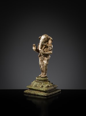 Lot 265 - A SILVER AND COPPER-ALLOY FIGURE OF GANESHA, CENTRAL JAVA, INDONESIA, 13TH CENTURY