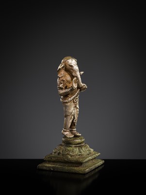 Lot 265 - A SILVER AND COPPER-ALLOY FIGURE OF GANESHA, CENTRAL JAVA, INDONESIA, 13TH CENTURY