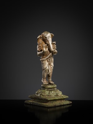 Lot 265 - A SILVER AND COPPER-ALLOY FIGURE OF GANESHA, CENTRAL JAVA, INDONESIA, 13TH CENTURY