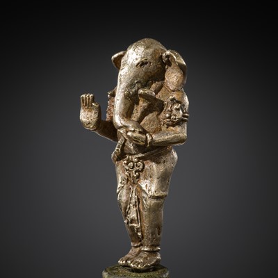 Lot 265 - A SILVER AND COPPER-ALLOY FIGURE OF GANESHA, CENTRAL JAVA, INDONESIA, 13TH CENTURY