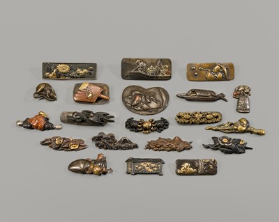 Lot 1314 - A GROUP OF TWENTY MIXED-METAL MENUKI AND OBIDOME