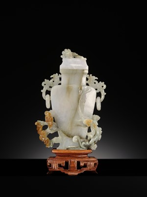 A CELADON JADEITE ‘CHILONG’ BALUSTER VASE AND COVER, LATE QING DYNASTY TO REPUBLIC PERIOD