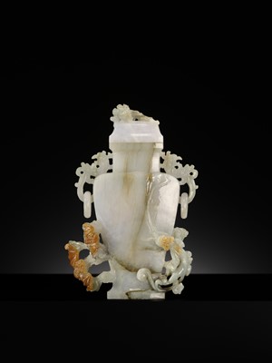 A CELADON JADEITE ‘CHILONG’ BALUSTER VASE AND COVER, LATE QING DYNASTY TO REPUBLIC PERIOD