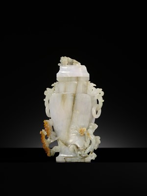 A CELADON JADEITE ‘CHILONG’ BALUSTER VASE AND COVER, LATE QING DYNASTY TO REPUBLIC PERIOD