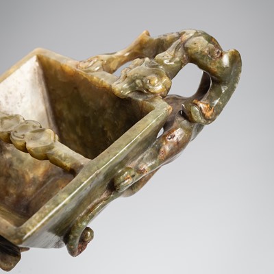 Lot 893 - A SMALL GREEN AND RUSSET HARDSTONE BRUSH WASHER, QING DYNASTY