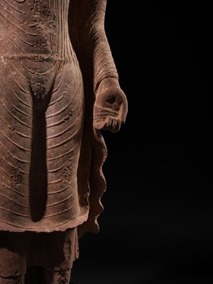 AN ICONIC RED SANDSTONE TORSO OF THE BUDDHA, GUPTA PERIOD, MATHURA, 3RD-5TH CENTURY