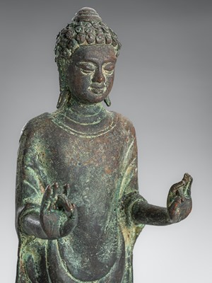 Lot 1373 - A COPPER ALLOY FIGURE OF A STANDING BUDDHA, JAVA, 9TH-10TH CENTURY