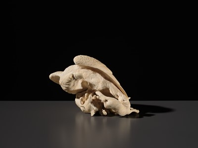 TOMOKAZU: A SUPERB IVORY OKIMONO OF AN EAGLE WITH TWO FOXES
