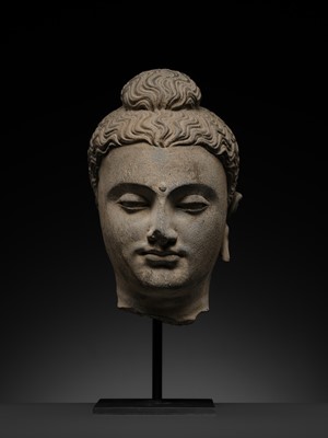 Lot 182 - A GRAY SCHIST HEAD OF BUDDHA, ANCIENT REGION OF GANDHARA, 2ND-3RD CENTURY