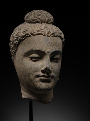 Lot 182 - A GRAY SCHIST HEAD OF BUDDHA, ANCIENT REGION OF GANDHARA, 2ND-3RD CENTURY