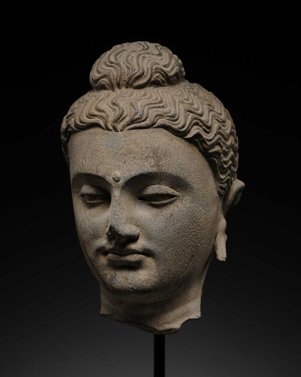 Lot 182 - A GRAY SCHIST HEAD OF BUDDHA, ANCIENT REGION OF GANDHARA, 2ND-3RD CENTURY
