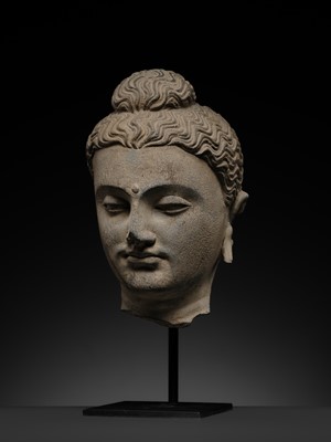 Lot 182 - A GRAY SCHIST HEAD OF BUDDHA, ANCIENT REGION OF GANDHARA, 2ND-3RD CENTURY