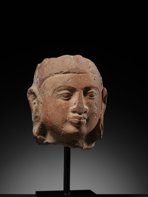 Lot 282 - A JAMMU TERRACOTTA HEAD OF A FEMALE DEITY, 6TH-7TH CENTURY
