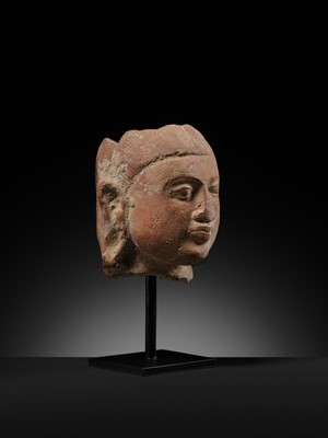 Lot 282 - A JAMMU TERRACOTTA HEAD OF A FEMALE DEITY, 6TH-7TH CENTURY
