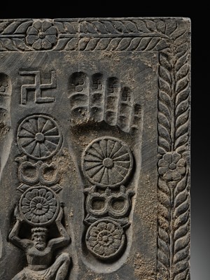 Lot 186 - A RARE GRAY SCHIST RELIEF OF THE FOOTPRINTS OF BUDDHA, BUDDHAPADA, ANCIENT REGION OF GANDHARA